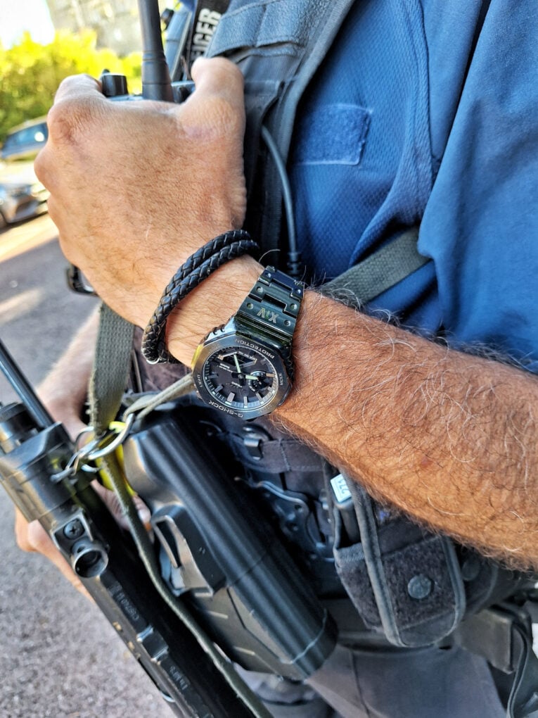 UK Royal Protection Officer wearing G-Shock GM-B2100 with band engraving