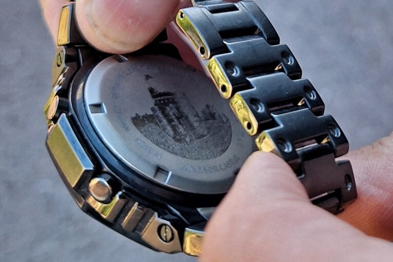 UK Royal Protection Officer wearing G-Shock GM-B2100 with custom case back engraving close-up